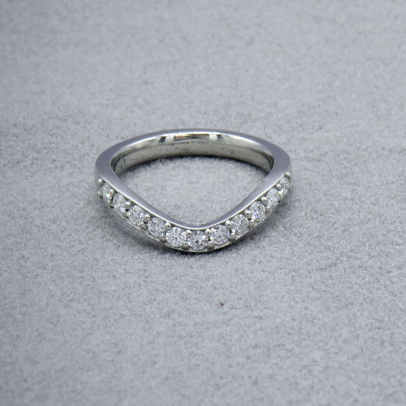 Curved diamond wedding ring