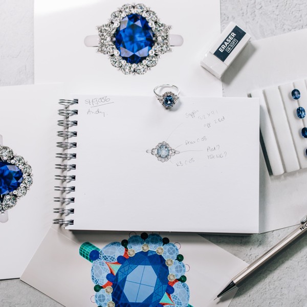 Drawings, pictures and a blue sapphire and diamond ring