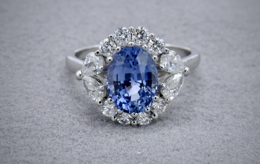 Bue sapphire and diamond halo rigng