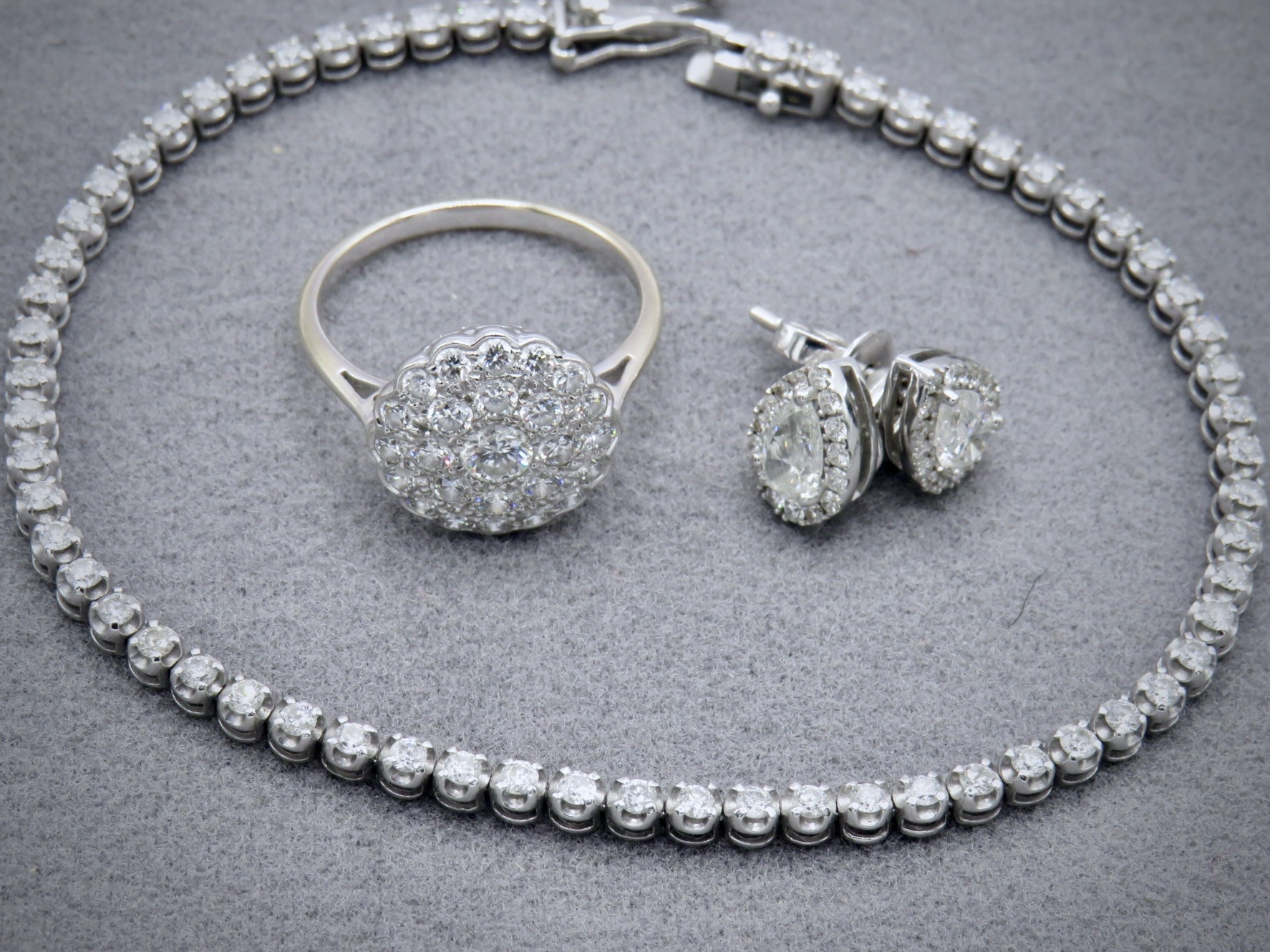 diamond bracelet, ring and earrings