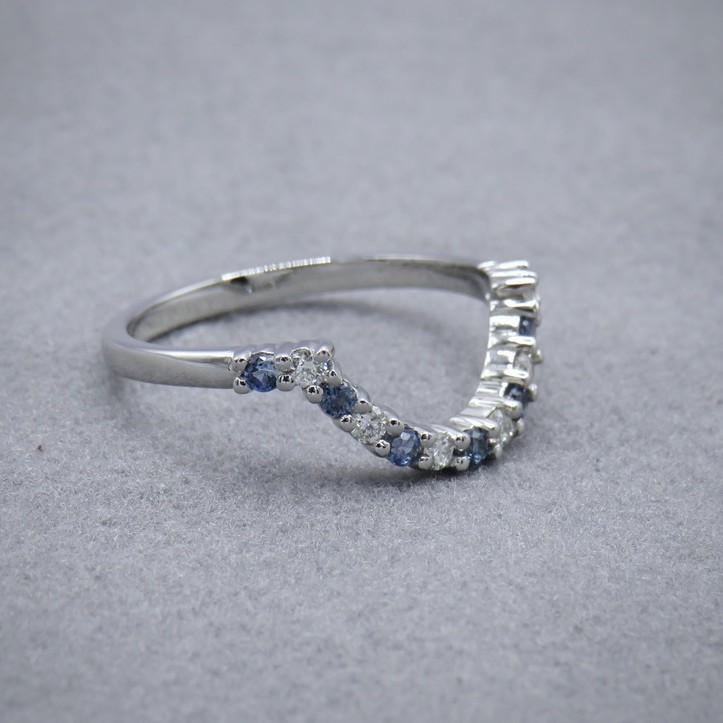 Curved sapphire and diamond wedding ring